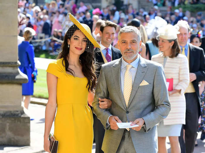 The couple wore two of their best looks to date at the wedding of Meghan Markle and Prince Harry.