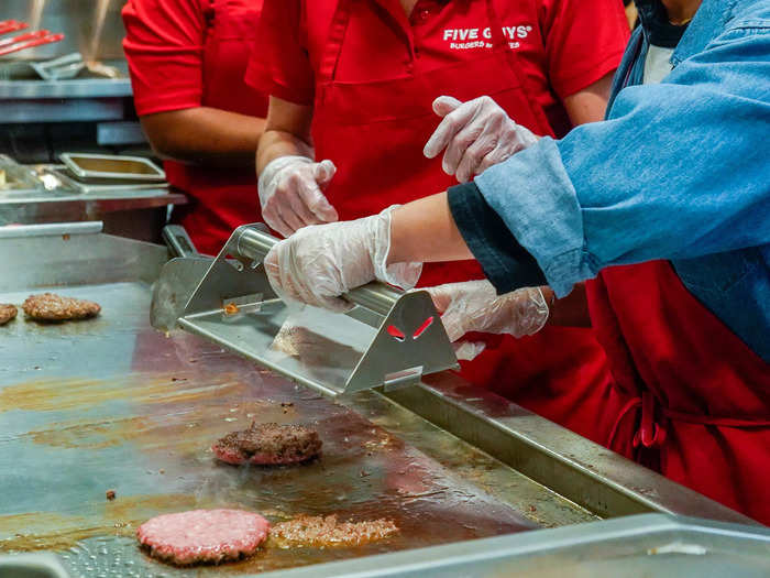 After the first flip, the patty gets smushed again and transferred to stage two of the grill.