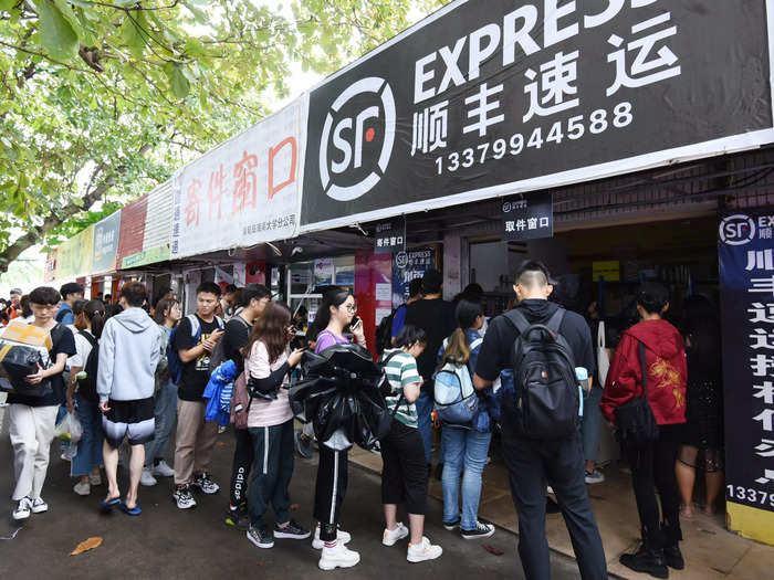 Some consumers, mainly college students, choose to receive their parcels at designated pick-up points, forming massive queues on Singles