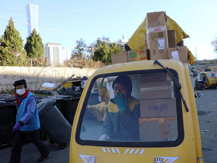 The rickshaw cab and the carton behind provide delivery guys with more space to stuff their vehicles with goods.