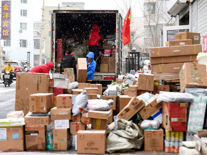 Delivery trucks hauling hundreds of packages through the winter snow are a common sight in Chinese cities after Singles