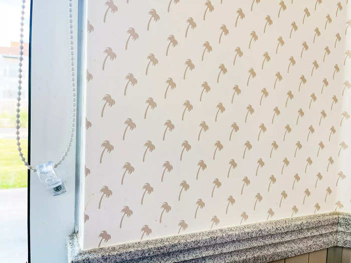 As I sat down at a counter by the window, I noticed that even the wallpaper was printed with palm trees.