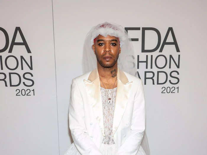 Kid Cudi arrived at the awards in a custom bridal gown by ERL.