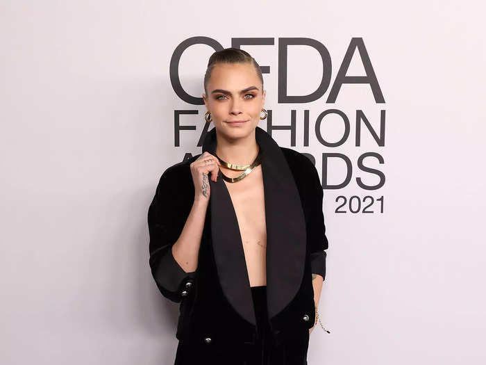 Cara Delevingne went shirtless in a velvet blazer and matching miniskirt.