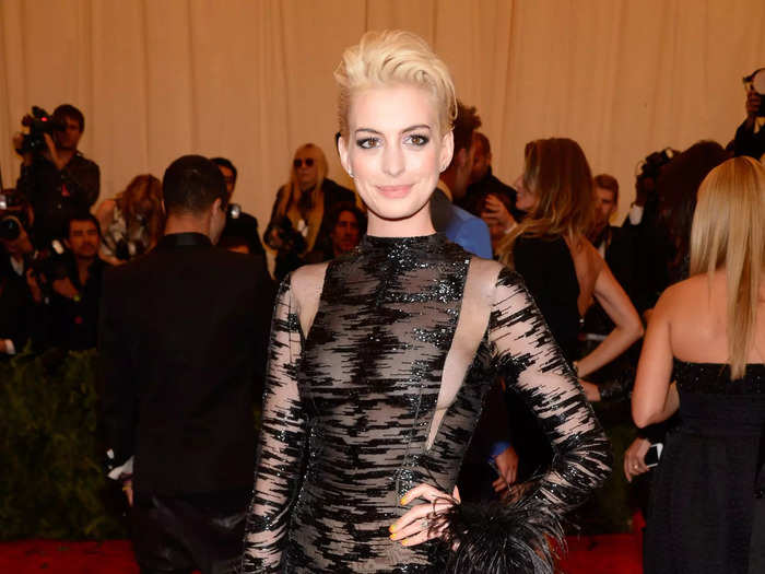 At the 2013 Met Gala, Hathaway bleached her hair and rocked this black gown with strategically placed sheer panels.