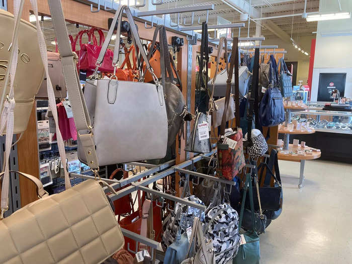 In the one-story TJ Maxx in the US, the purses were all up at the front of the store, near the windows ...