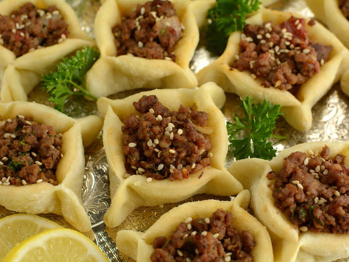 Lebanese meat pies, or sfeehas, are stuffed with pine nuts.