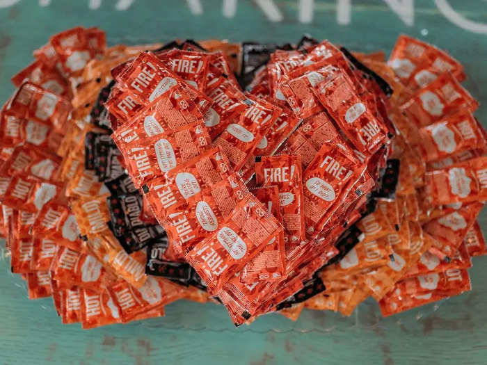 An employee made a surprise heart-shaped cake out of Taco Bell sauce packets that served as a centerpiece.