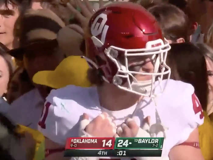 The close quarters were especially awkward for Oklahoma players waiting for the game to end.