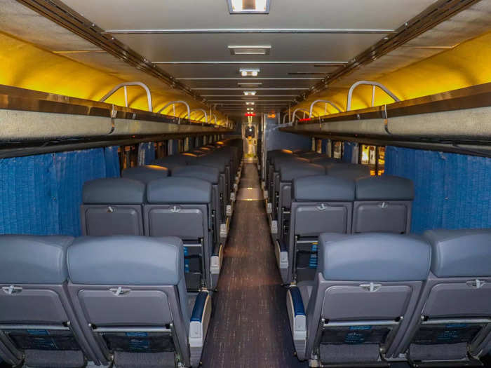 Coach class cars feature the bulk of the seating with two-seat pairs on both sides of the aisle.