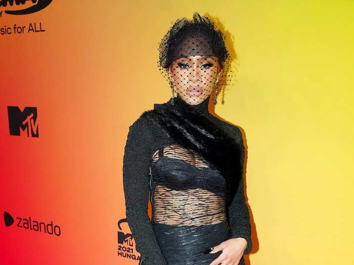 Saweetie - who hosted the show - arrived in a black bra and underwear covered with a lace overlay.