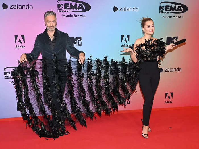 Rita Ora chose a feathered, semi-sheer jumpsuit for her appearance at the event.