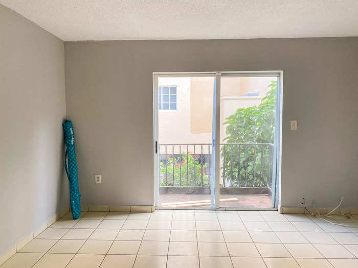 I was excited when I saw a sliding patio door in the living room leading to a small balcony.