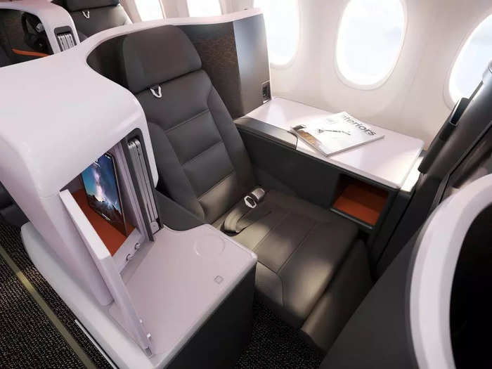 Unlike the 2-2 rows, the throne seats offer extra table space, direct aisle access, three-inch wider seats, an added cubby with a mirror and LED light, and more privacy.