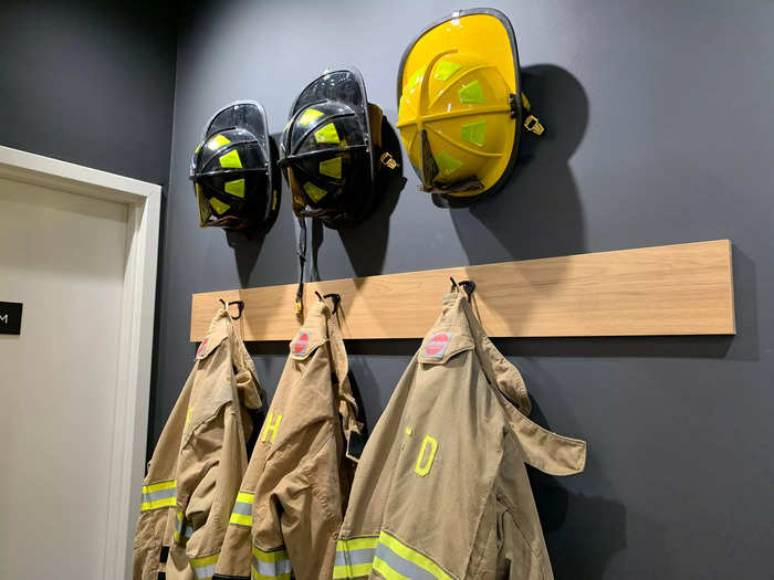 The firehouse theme extended even into the far corner of the restaurant, with fire hats and uniforms hanging on the wall.