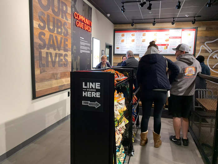 Most of the interior of the restaurant is space for waiting customers alongside chips and other snacks, similar to the setup of other fast casual chains.