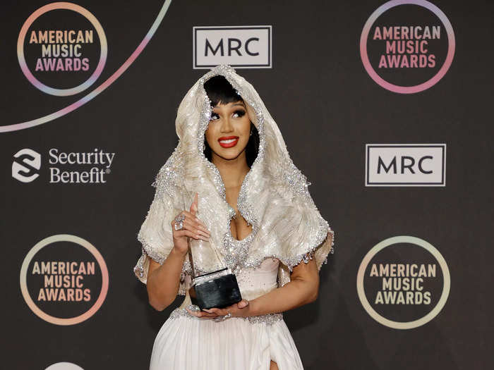 Cardi B brought the night to a close in a daring white gown with a leg slit and bejeweled veil.