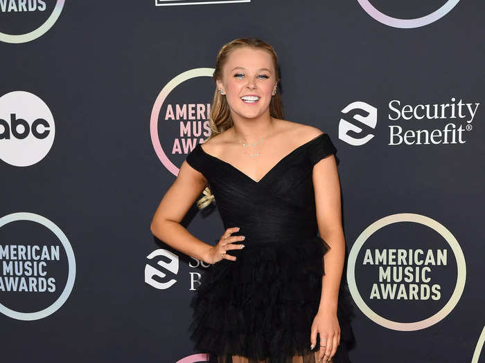 For her first time wearing a dress and heels on a red carpet, JoJo Siwa made a statement in black gown with a sheer skirt.