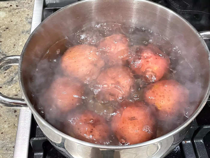 I brought the pot to a boil, then lowered the heat and covered the potatoes.