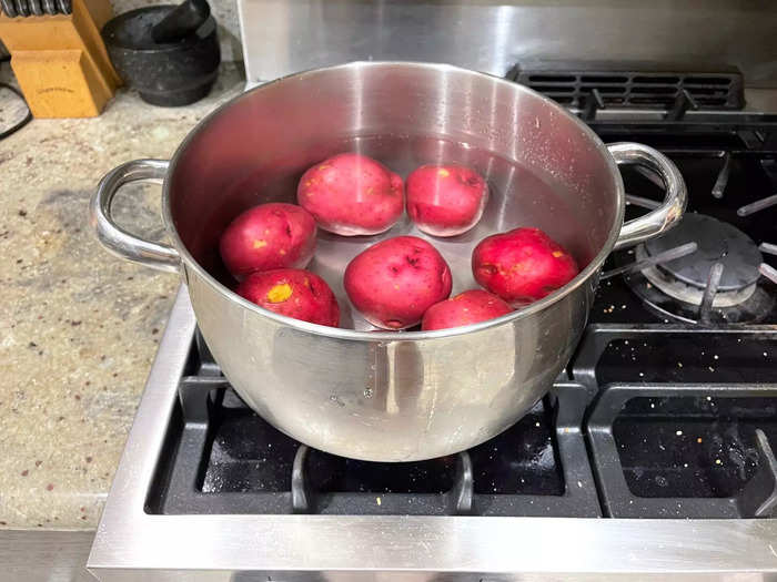 To begin, I first placed my potatoes in a pot with cold water.