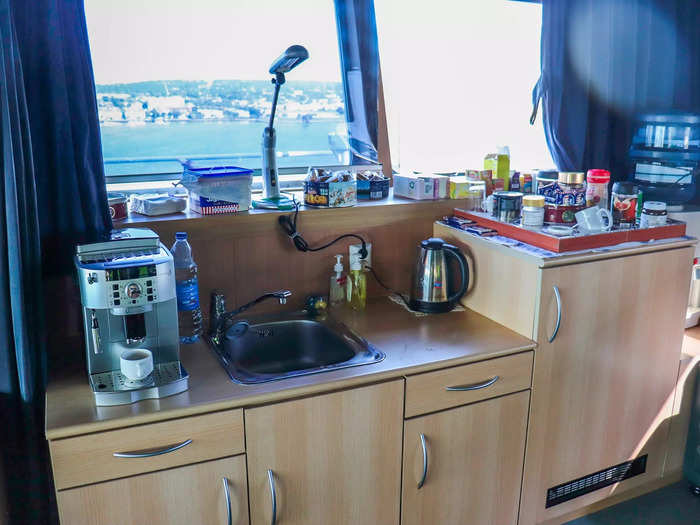 The bridge also features a small kitchenette with a coffee maker.