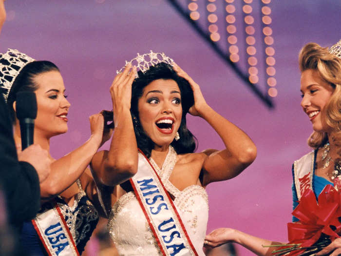 Shanna Moakler of Texas became Miss USA in 1995 wearing a white, embellished gown with a statement neckline.