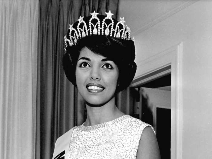 Macel Wilson, a contestant from Hawaii, was named Miss USA in 1962, while wearing an elegant dress with an embellished top.