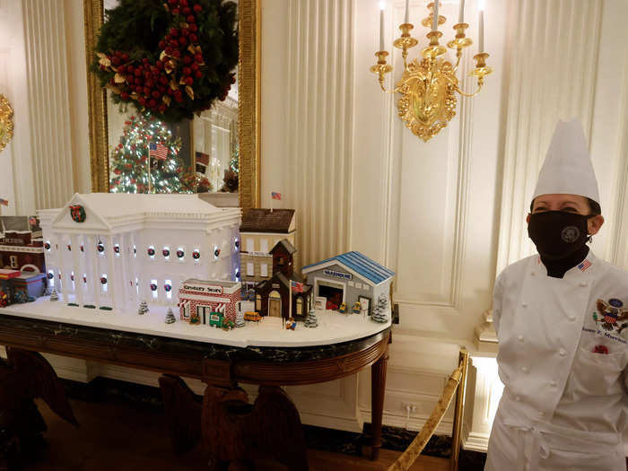 The main attraction in the State Dining Room is the official 2021 Gingerbread White House, created by White House pastry chef Susan Morrison.