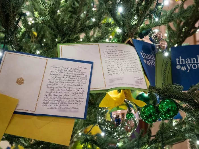 Letters and thank-you notes sent to Biden hang among the ornaments.