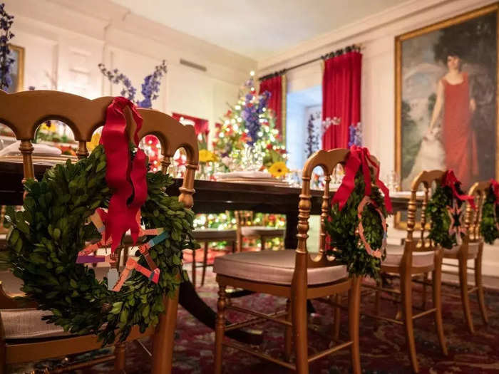 A wreath hangs from the back of each chair in the China Room.