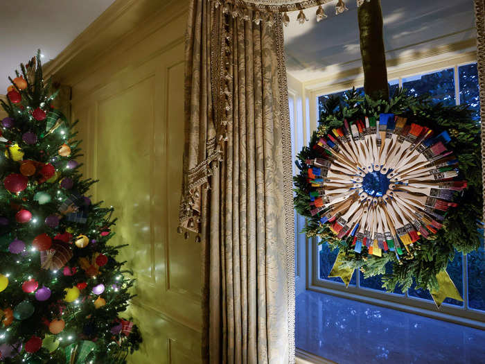 Paintbrush wreaths in the Vermeil Room "celebrate the Gift of Visual Arts," according to the White House Holiday Guide.