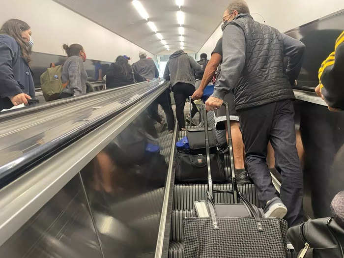 The only time I experienced a bigger crowd was on the tram, which was busy but not shoulder-to-shoulder packed, and on the escalators up to the terminal. However, once in the hall, everyone dispersed and there was plenty of room to walk.