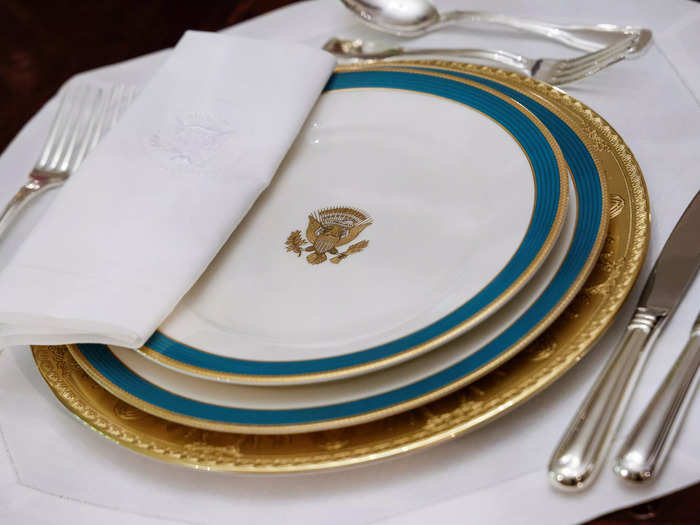 The table in the China Room is set with the Obama state china, a nod to Biden