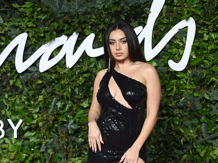 Charli XCX turned heads in a sparkly Tommy Hilfiger gown with a cutout across her chest.