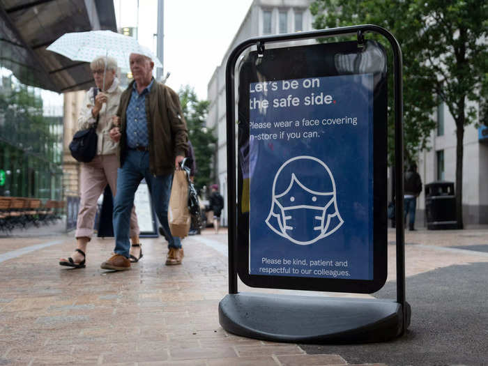 This British grocer, for example, had signs encouraging shoppers to wear masks "if you can."