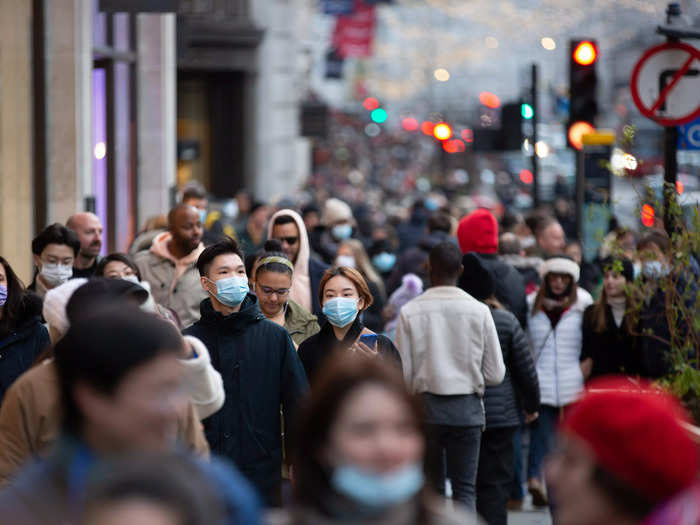 The government does, however, encourage people to wear masks in places "which are crowded and enclosed and where you may come into contact with people you do not normally meet," without requiring it.