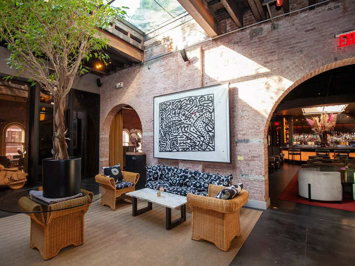 Now onto the next room, which is just past the two large archways. This separate lounge area topped with a large skylight that floods the room with natural light.