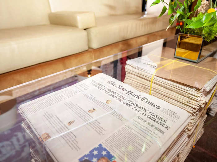 … and stacks of the New York Times newspapers that serve as coffee table legs.