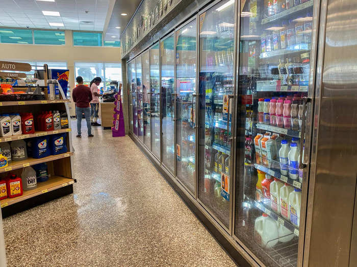 Next to a long row of refrigerated drink cases, I found a small auto section, which I thought might come in handy during long road trips.