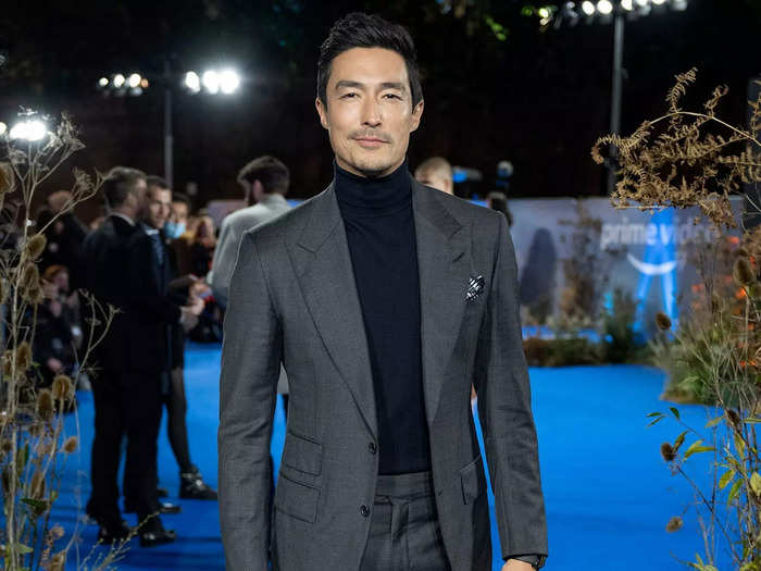 Daniel Henney does not normally have his hair tied up in a bun but looks just a stoic as his character.