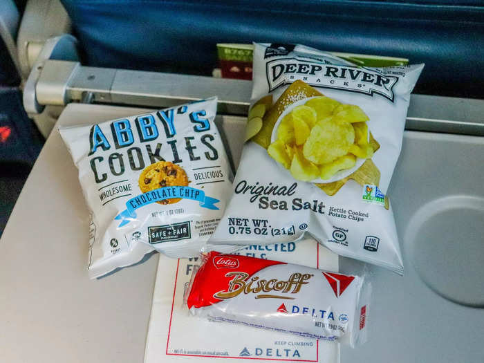 Flight attendants came around just after takeoff with a small snack basket, Options for Comfort+ passengers included chocolate chip cookies, potato chips, Kind bars, Biscoff cookies, and more.