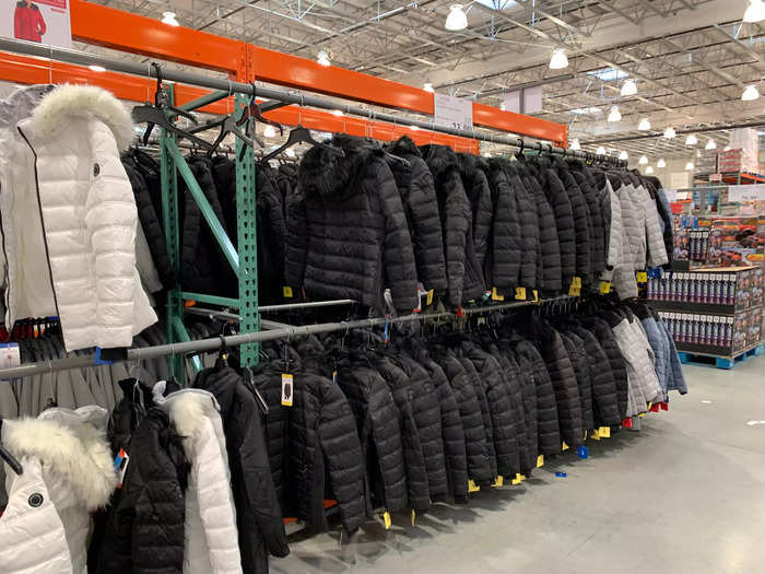 There are rows and rows of coats, sweatshirts, leggings, sweatpants, and other clothing for men, women, and children.