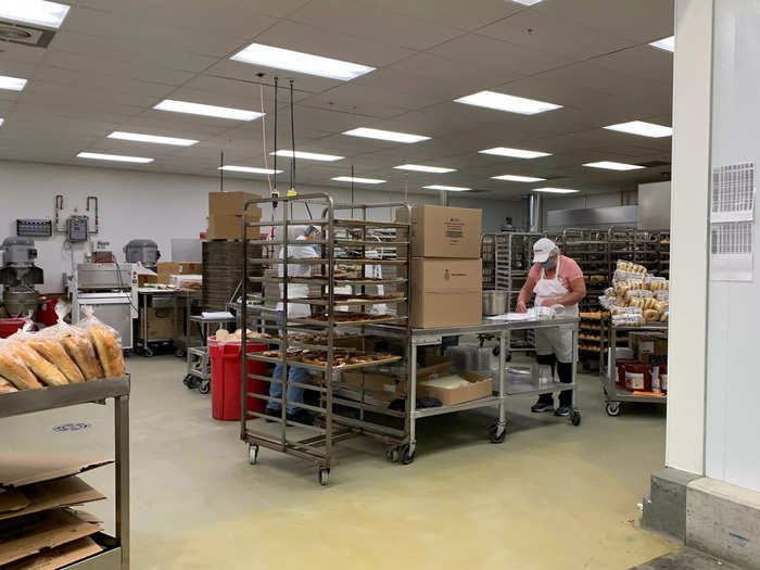 You can look back behind the counter and see the bakery employees preparing more products.