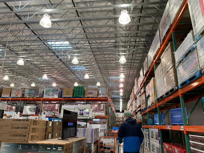 Ceilings are extremely high, and stocks of products extend nearly all the way up. Many of the largest products at Costco are located along this side wall.