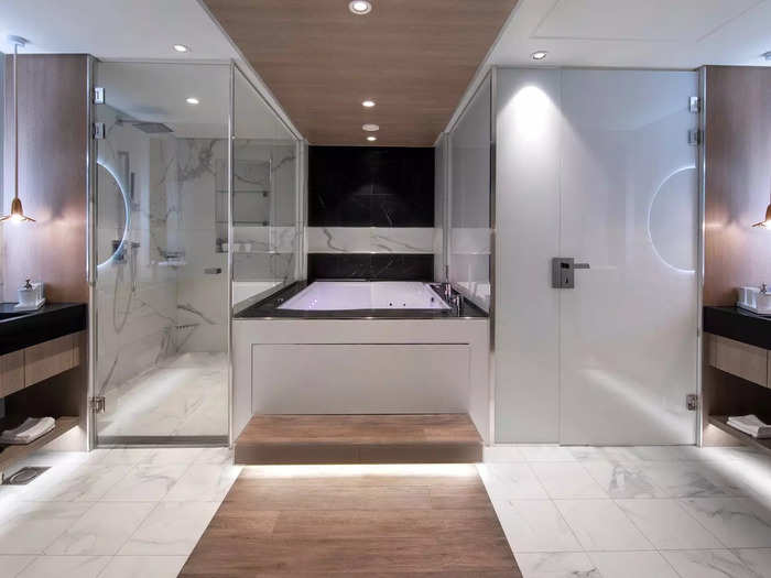 … lined with two vanities, a shower, and a tub in case the one on the terrace wasn