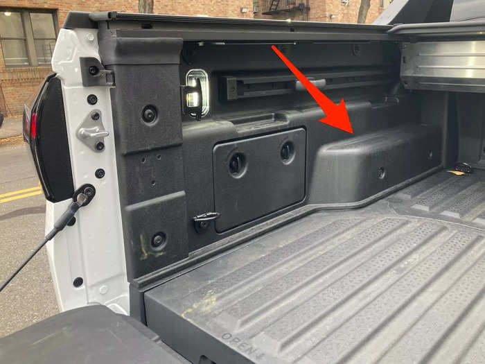 To do that, you adjust the tailgate to a middle position between open and closed. Then, you can lay sheets of plywood across the tailgate and purpose-built grooves in back of the bed.