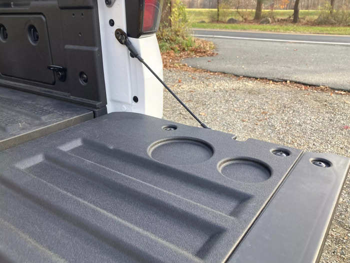 The inside of the tailgate has a few indents stamped into it for beverages.