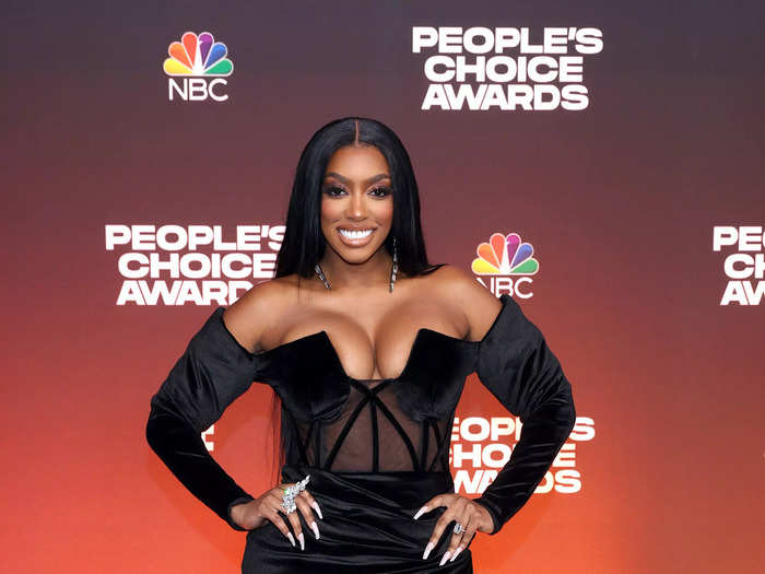 Porsha Williams wore a velvet gown designed with a sheer bodice and thigh-high slit.