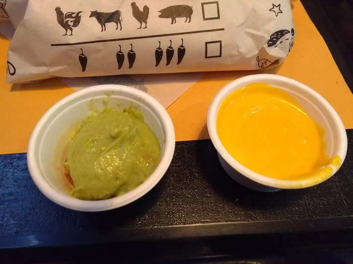 It tasted artificial and though it was melted it was wet, thick, and gooey rather than stringy when I dipped my fries in. The guacamole was good but nothing exceptional.