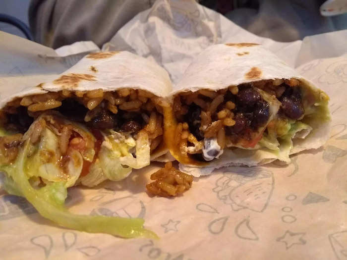 The Seven-Layer Burrito is still on the menu in the UK, even though it disappeared from US restaurants during the pandemic. The layers were hard to distinguish by eye, but it tasted good. At some burrito bars I